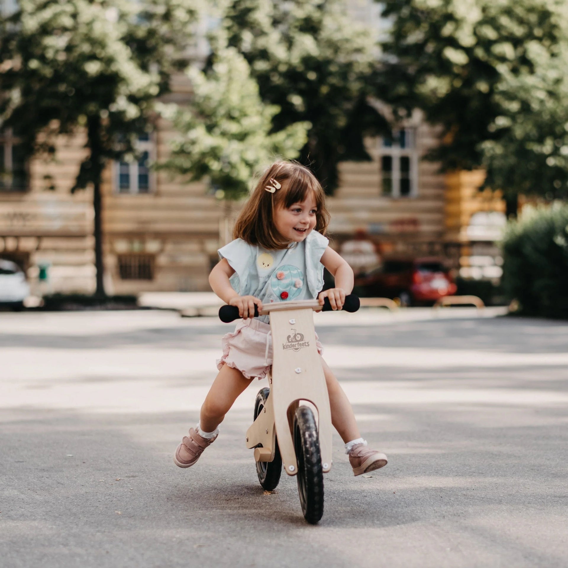 buy balance bike image girl riding in park