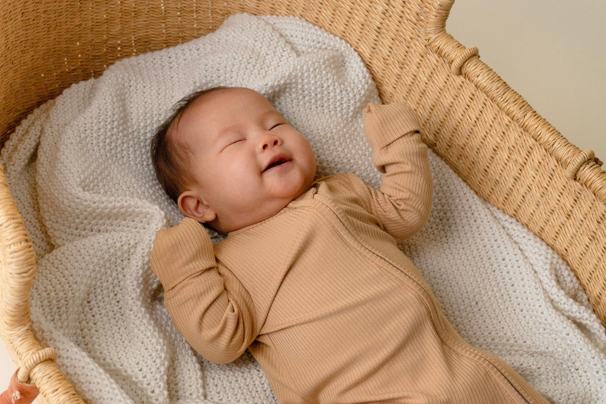 baby mittens for hands reduce scratching, baby smiling with baby mittens on
