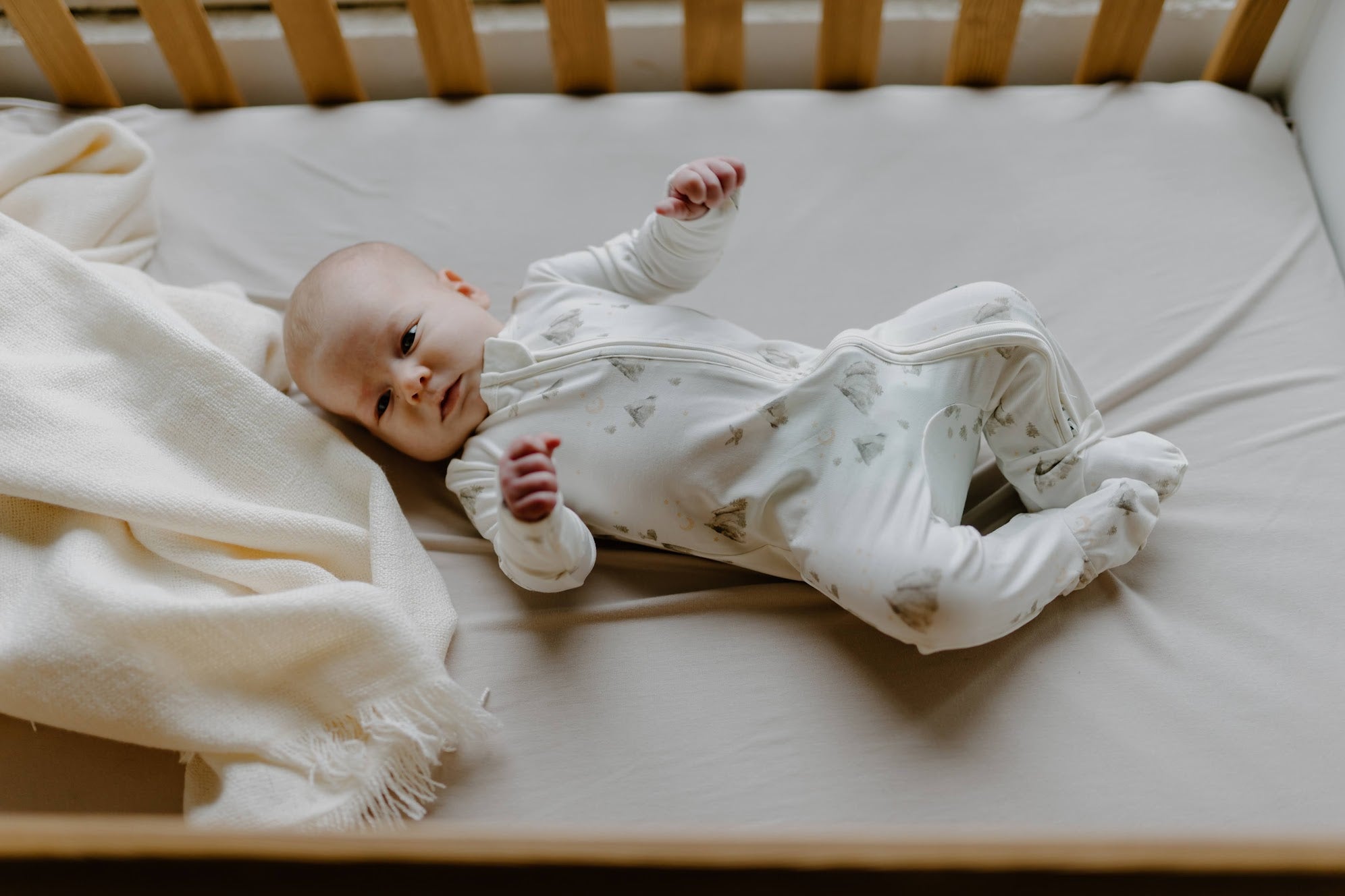 newborn baby in a crib