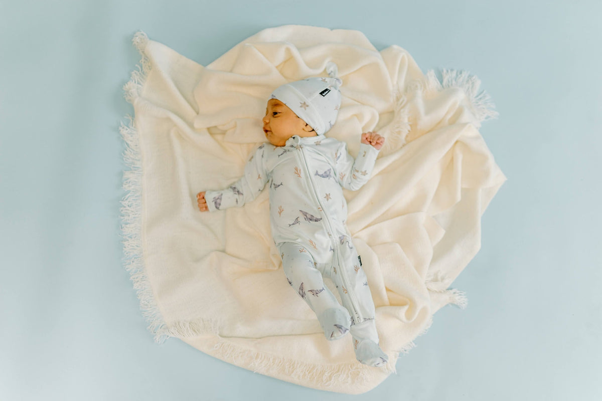 baby sleepwear image baby sitting on blanket