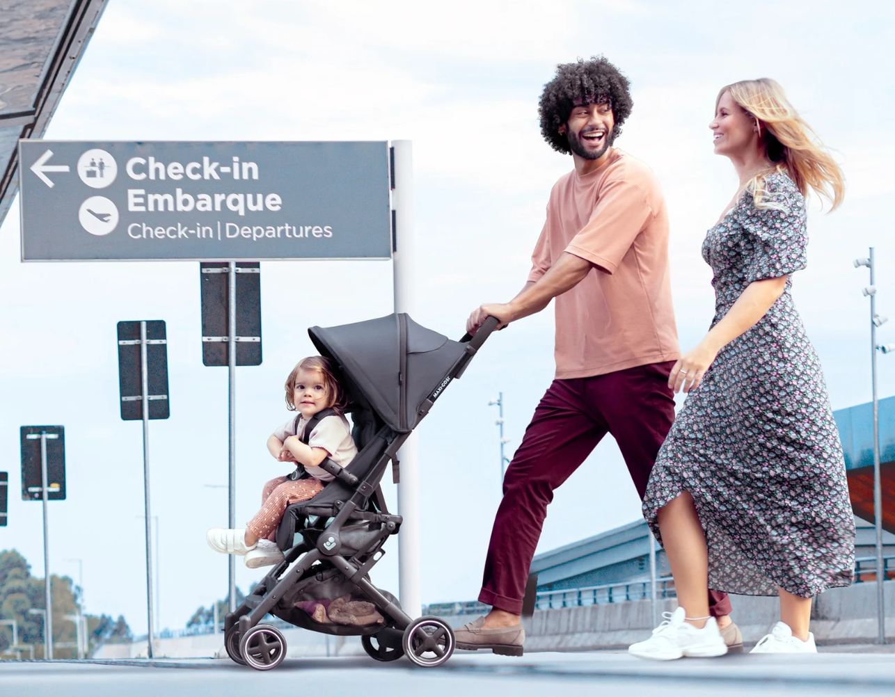 travel strollers canada parents walking in airport with stroller