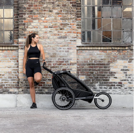 thule strollers canada lady standing with stroller