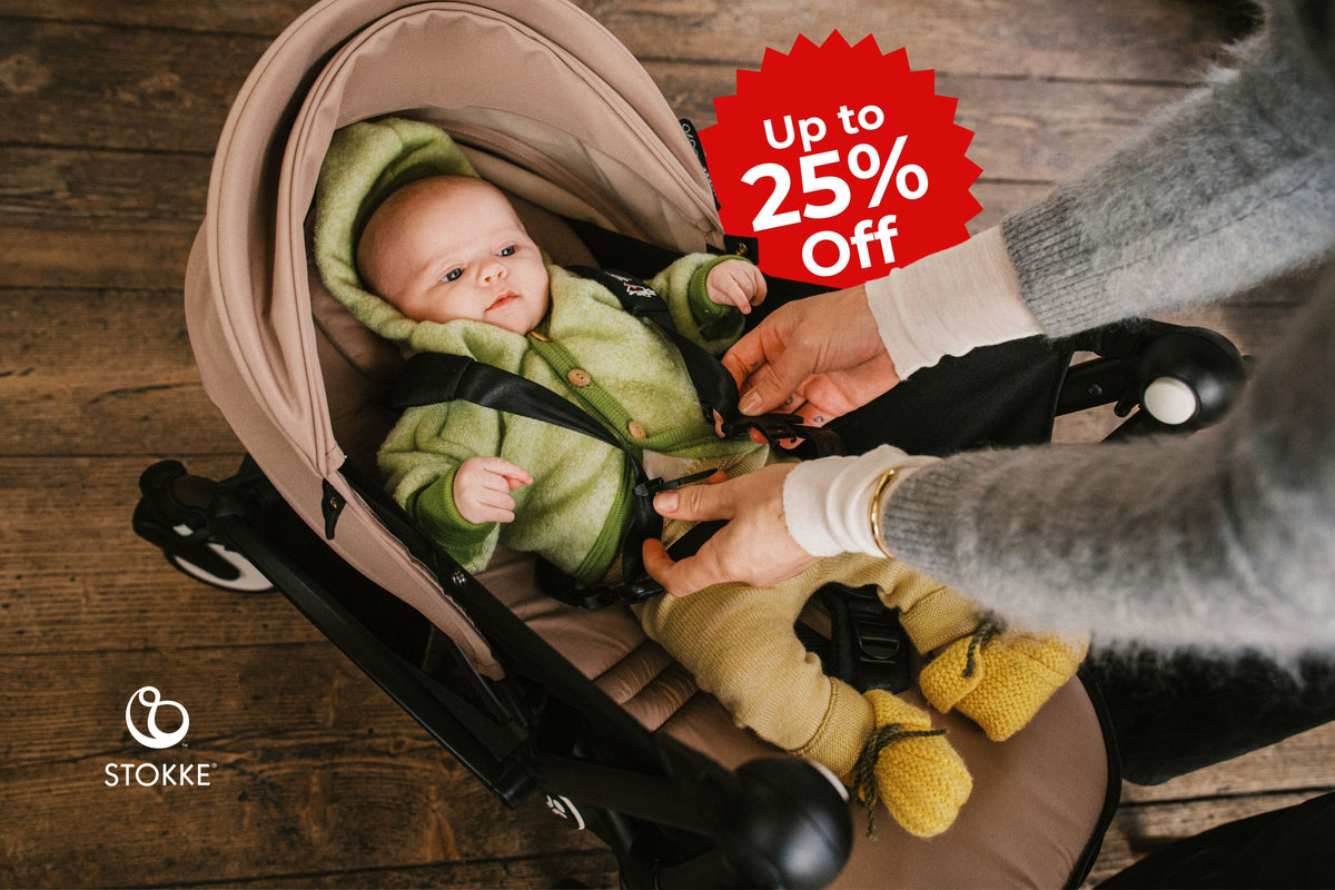 Baby in a Stokke stroller